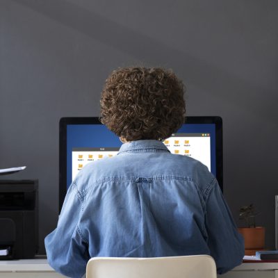 woman-working-desk-back-view